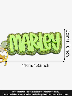 Custom glitter acrylic name keychain showing laser engraved text in colorful designs