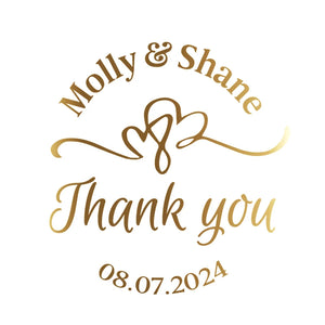 Clear gold foil thank you stickers applied on candle jars