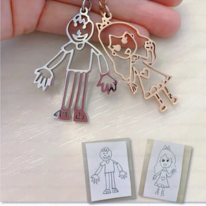 Children’s drawing turned into custom stainless steel keychains and necklaces