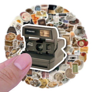 Vintage aesthetic VSCO stickers decorating a laptop and notebook