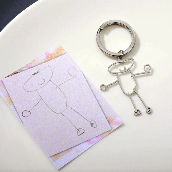 Handmade cartoon character keychains and necklaces based on kids artwork