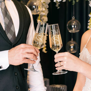 Custom champagne flutes for bride and groom with elegant name engraving

