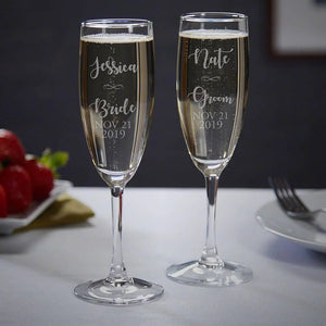Custom champagne flutes engraved with couple names and date