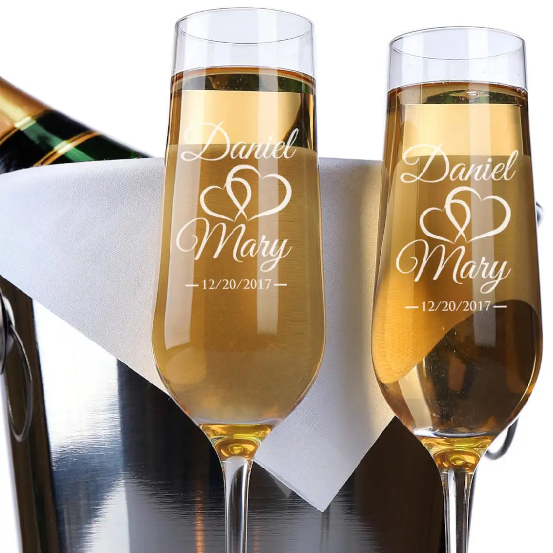 Clear glass champagne flutes customized with elegant typography
