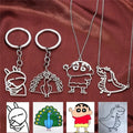 Custom cartoon character keychains and necklaces made from kids drawings in stainless steel