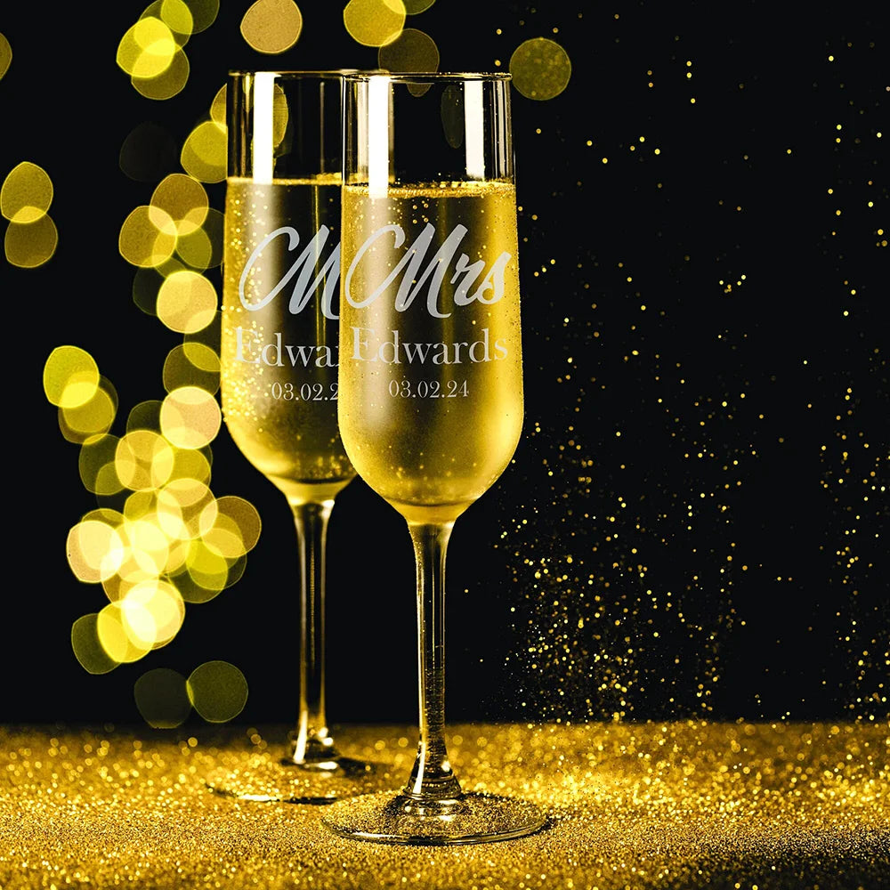 Close-up of laser engraved champagne flute showing frosted white personalized text