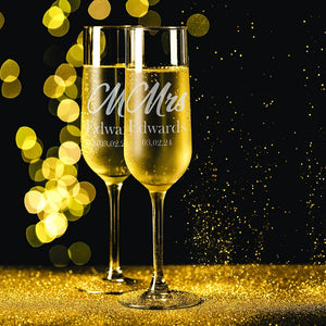 Close-up of laser engraved champagne flute showing frosted white personalized text