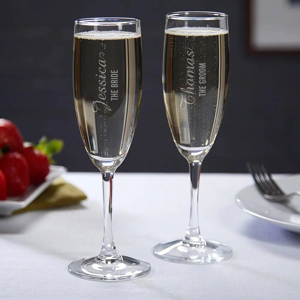Engraved wedding champagne glasses for bride and groom toast
