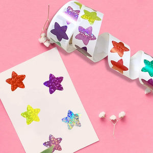 Glitter kawaii star stickers roll displayed on pink background for kids crafts and rewards