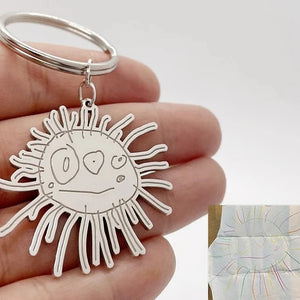 Custom stainless steel keychains created from children’s drawings and sketches