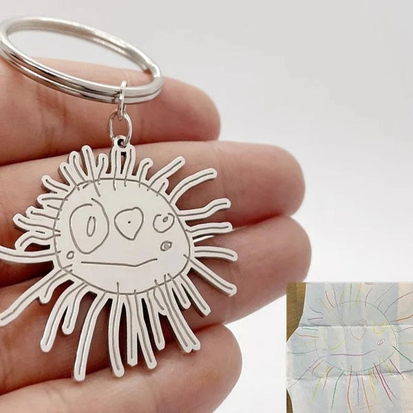 Custom stainless steel keychains created from children’s drawings and sketches