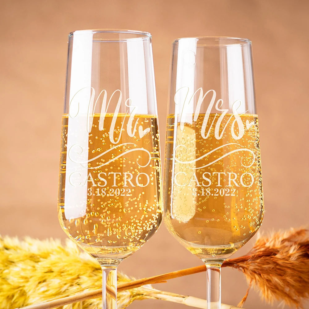 Personalized Mr and Mrs champagne flutes engraved with names and wedding date