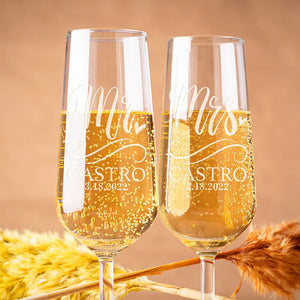 Personalized Mr and Mrs champagne flutes engraved with names and wedding date