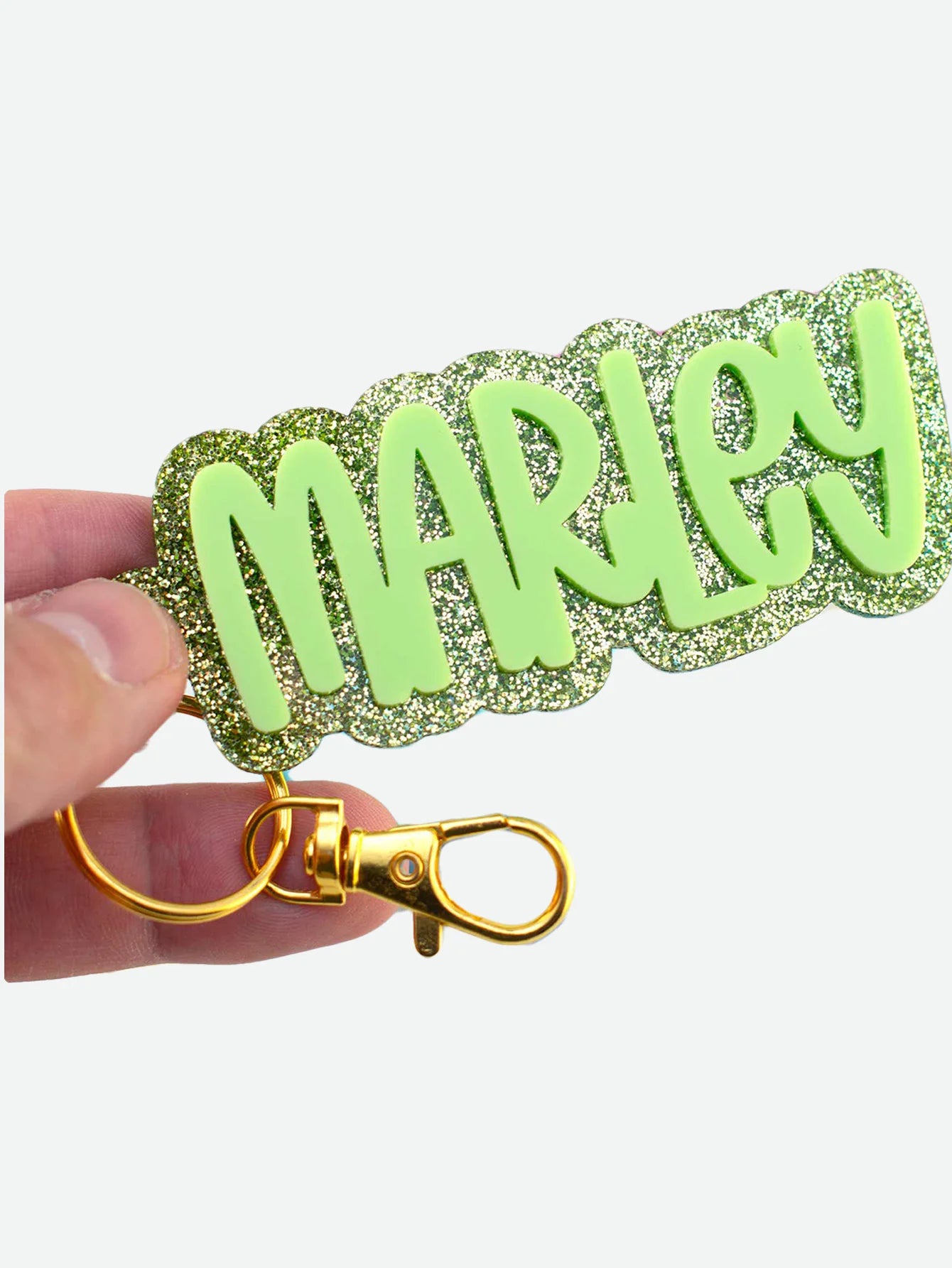 Personalized acrylic name keychain used on backpack and keys, custom engraved gift