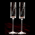 Personalized wedding champagne flutes with laser engraved names and tall elegant design