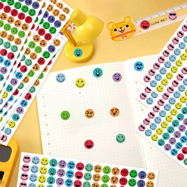 Close-up view of round smiley face stickers showing bright colors and smooth sticker finish