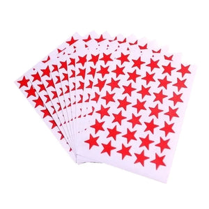 Star award stickers displayed on a classroom reward board celebrating student achievements