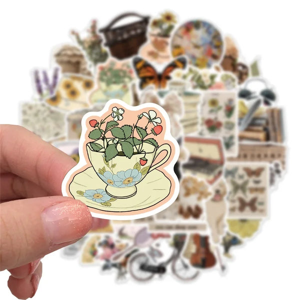 Cute vintage aesthetic stickers decorating a journal and planner pages